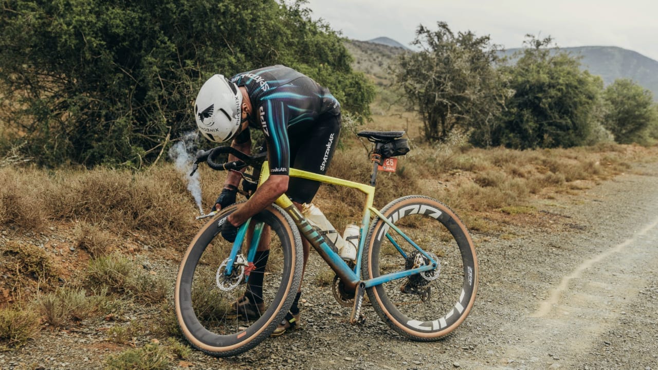 Alistair Brownlee deals with a puncture during the Gravel Burn event in South Africa.